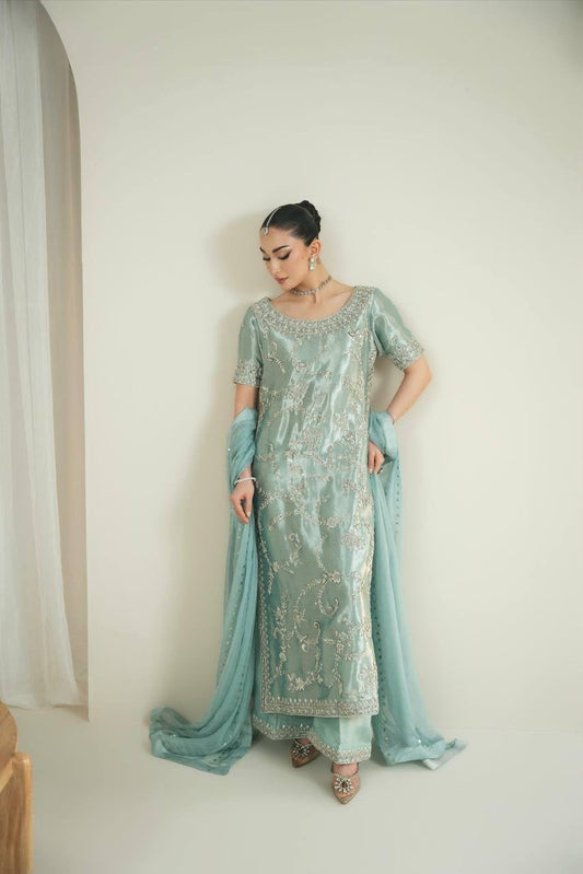 Mint Blue Pure GMY Silk Palazzo Set - flat lay hanger overhead view showing complete top front with all-over heavy trailing floral vine embroidery and sequins in gold silver thread, dense scrollwork embroidery hem border with gold lace trim, round scoop neckline with heavy embroidery border, and matching faux georgette dupatta with scattered embroidery sequins work