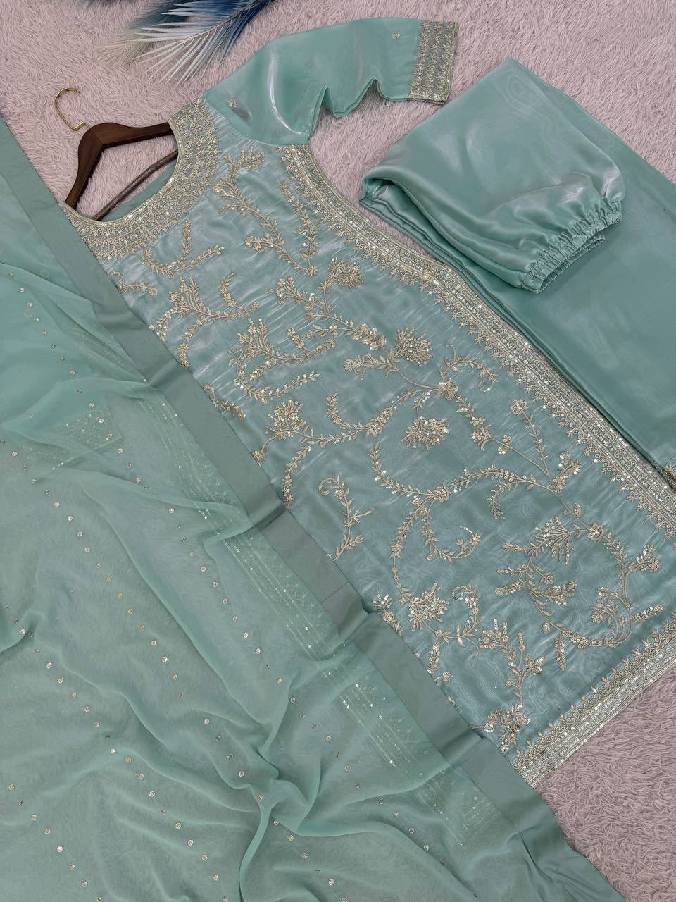 Mint Blue Pure GMY Silk Palazzo Set - flat lay close-up showing top lower half and palazzo with spectacular wide heavy embroidery and sequins work hem border band on palazzo, straight gold lace trim, and all-over trailing floral vine embroidery on both top and palazzo in gold silver thread with iridescent sequins