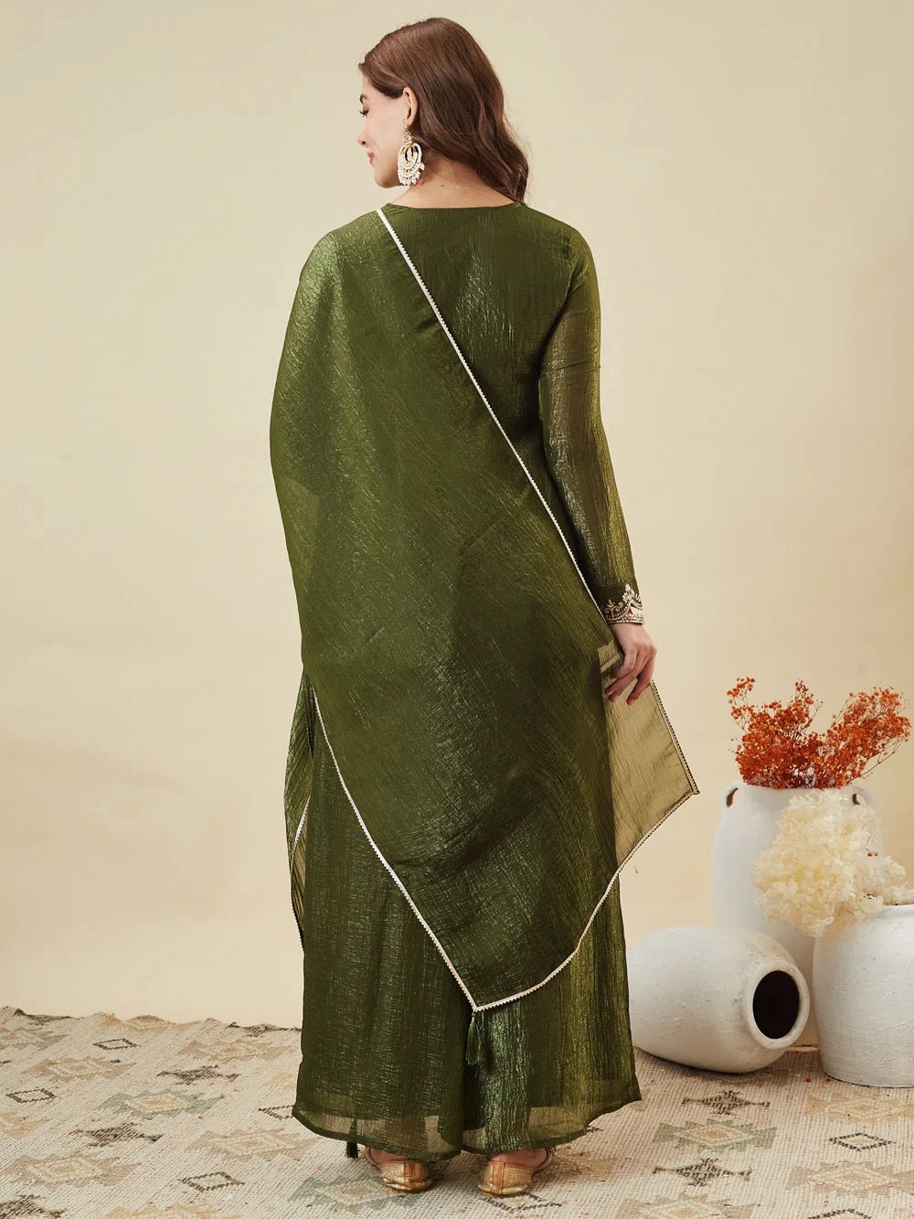 Olive Green Crunchy Silk Kurta Palazzo Set - studio close-up portrait showing elaborate white thread yoke embroidery with trailing floral vine motifs daisy clusters and scrolling leaf work, gold bead neckline trim, matching dupatta with pearl lace border and full sleeves with gold sequence lace cuff trim