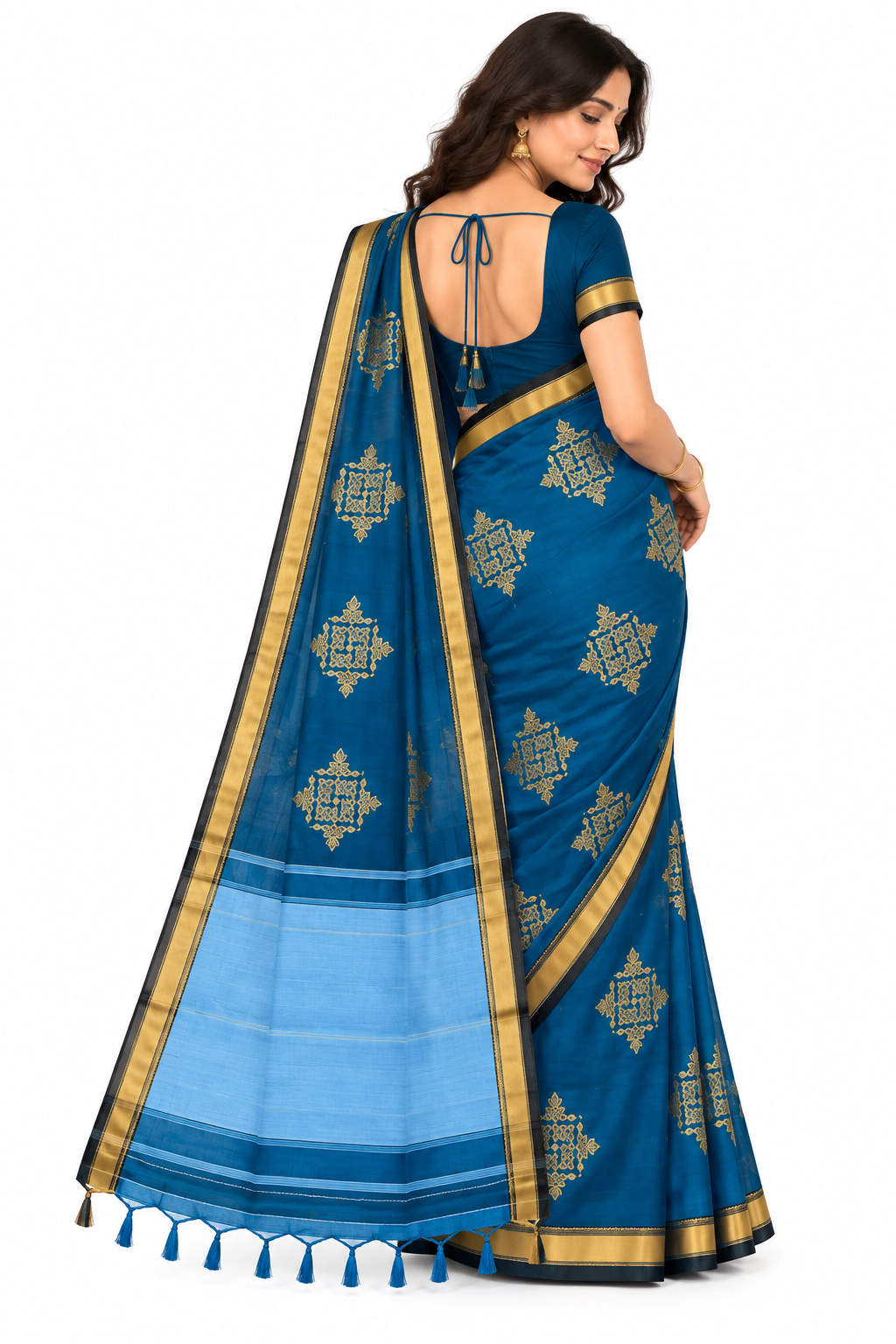 Peacock blue Kolam saree styled indoors with gold jewellery