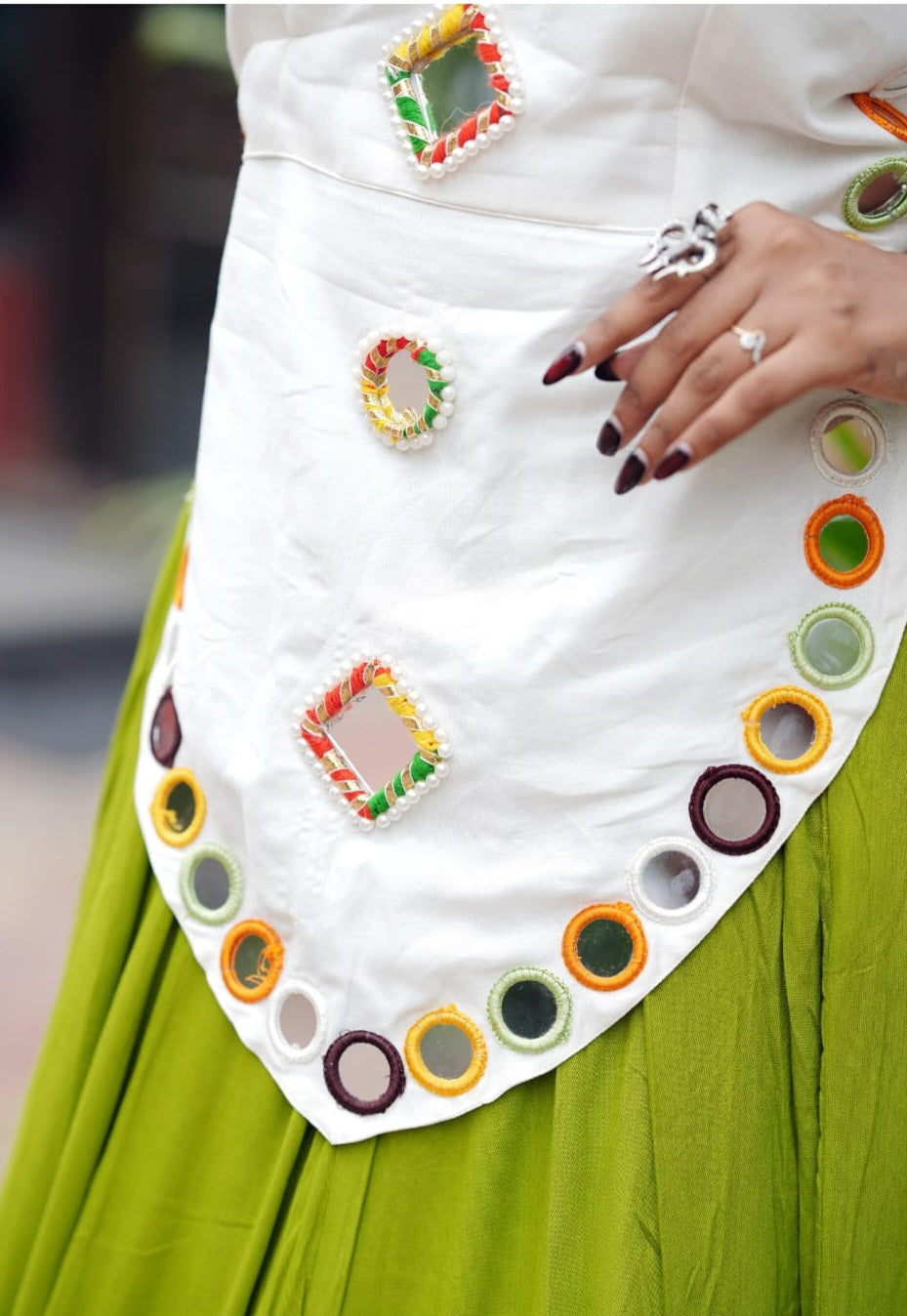 Lime Green White Rayon Chaniya Choli - close-up detail of scallop overlay panel showing real square mirrors with rainbow braided thread borders, real round circular mirrors with multicolour alternating thread rings, and dense row of round multicolour mirror rings along scalloped lower edge