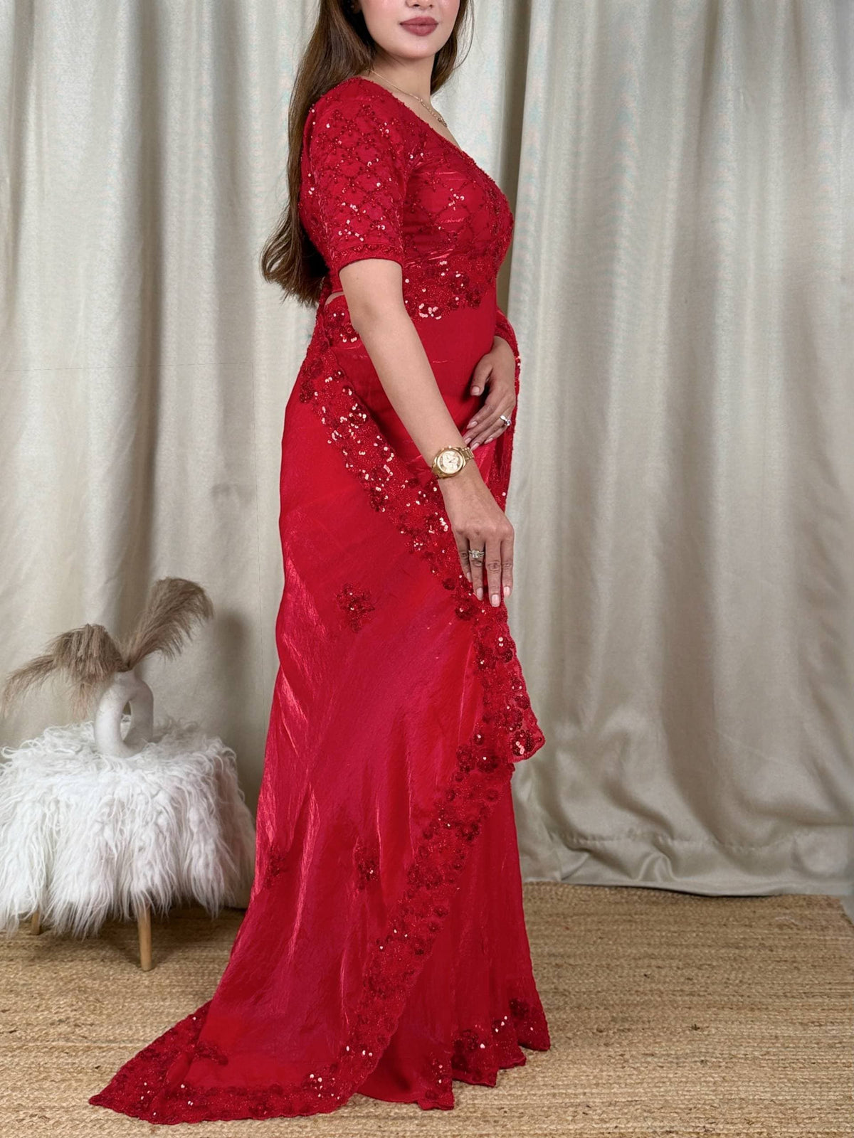 Crimson Red Fandy Satin Saree - studio full length standing model front view showing complete saree draped with all-over diamond lattice sequence body, 3D raised red floral bouquet butti scattered across body, scallop cutwork sequence border at hem and pallu, with matching full-coverage sequence embroidered crimson satin blouse