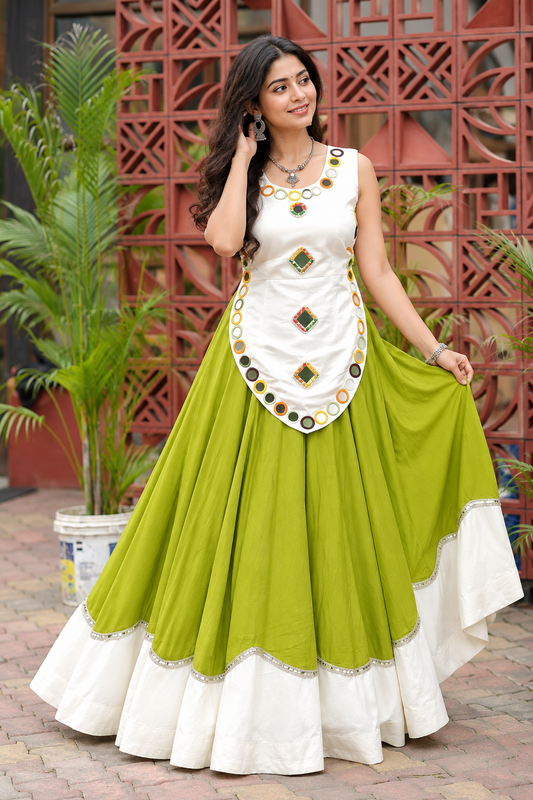 Lime Green White Rayon Chaniya Choli - outdoor terrace front view model showing white sleeveless blouse with real multicolour square and round mirror work, scallop overlay front panel with round mirror ring border, lime green full-flare lehenga with two-tier scalloped hem and silver sequence lace trim